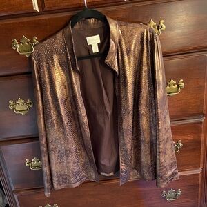 A Chico’s copper colored jacket with studded front.
